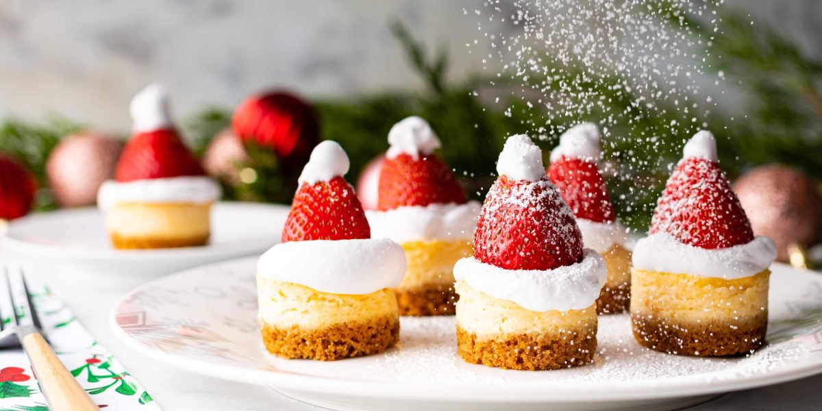 Mini Santa Hat Eggnog Cheesecakes are pictured